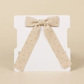 Beige corduroy hair bow clip with gold polka dots on a white display card - Beige