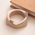 Macro shot of geometric hexagonal wooden bangle showing detailed natural multilayer wood grain - L414-1 Wood Color Circle Hexagon