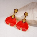 Retro gold fishtail earrings with red enamel rhombic texture on marble background - Red