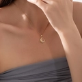 Gold necklace featuring a crescent moon pendant with micro-pave zircons and tiny star - Gold Moon Zircon Necklace