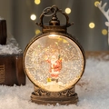 Bronze Christmas lantern with Santa Claus figurine and sparkling snow globe effect - Backpack Santa