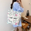 Canvas tote bag in beige featuring a cute cartoon rabbit and pink flower pattern print - Line Rabbit