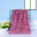 Purple coral fleece towel with embossed bear pattern and wavy scalloped edge - Dust Rose