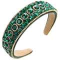 Close-up of emerald green baroque headband with detailed rhinestones and gold bead trim - Green