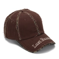 Detail of distressed brown baseball cap with embroidery and camo fabric layers - One Size / Coffee