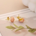 Detail view of pink teardrop marble studs with golden stainless steel butterfly backings - Gold Style 4-Peach Pink Bean