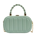 Elegant mint green quilted chain handbag with a unique twisted top handle and gold hardware - Green