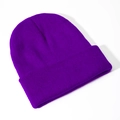 Detailed view of the fine rib knit texture and folded cuff on this deep purple beanie - Dark Purple