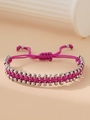 Close-up of rose red woven cord bracelet with silver stainless steel beads and adjustable knot - Purple
