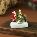 Gedetailleerd lichtgevend huis van hars met Kerstman en kinderen op besneeuwde basis - Kerstman & Kind