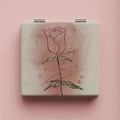 Macro detail of square foldable makeup mirror with minimalist red rose line art pattern - Line Rose