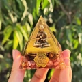 Orgone resin pyramid with gold Buddha, pink and brown crystals, and Flower of Life base - Style 11