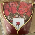 Macro view of a 3D pop-up greeting card featuring a bouquet of red roses in clear packaging - Rose