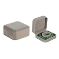 Gray velvet octagonal jewelry box displaying a green bracelet inside on a white background - Gray