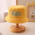 Detail view of yellow cotton kids bucket hat with smile face print and windproof cord - 54cm (3-8 Years) / Yellow