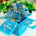 3D pop-up birthday card in sky blue and gold featuring a layered paper-cut cake - Blue Gold Stamped