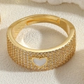 Macro detail of 14K gold plated open ring featuring micro zircon and white heart inlay - White