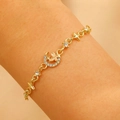 Elegant gold bracelet with moon butterfly and star charms featuring crystal accents - 14k Light Gold Moon Butterfly Stars Style (11677)