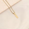 Gold plated box chain necklace with a textured rectangular bar pendant on stone - Letter I