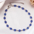 Silver chain bracelet featuring blue evil eye charms with lobster clasp and extender link - Silver Base Dark Blue