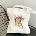White canvas tote bag featuring a watercolor giraffe print with a floral crown design - C6 Impressionist Giraffe