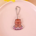 Cute acrylic capybara keychain with orange on head sitting on pink lotus with bead chain - Capybara on Lotus Base