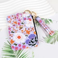 Floral print card holder with purple pattern, featuring metal clasp and tassel detail - Purple Floral