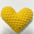 Handmade yellow crochet heart ornament with detailed knit texture and soft filling - Golden Yellow Heart