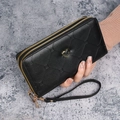 Women's long double zipper wallet in black faux leather with heart charm and wristlet - Black