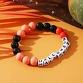 Halloween beaded bracelet with orange and black beads featuring HALLOWEEN letter charms - Halloween HALLOWEEN Letters Orange Black
