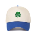 Detailed embroidery of a green lucky clover on a cream and navy trucker baseball cap - Adjustable / Cream/Royal Blue