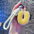 Litchi pattern leather key ring featuring letter U with cream white woven wrist strap - Letter U