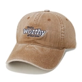 Detailed texture of washed cotton baseball cap with blue embroidered letter lettering - Brown