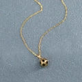Detailed close-up of a gold-plated stainless steel football pendant with O-chain link - O-Chain Gold