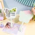 Close-up of light green butterfly shaped hand mirror with dual side views for DIY craft - Green