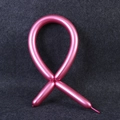 Metallic rose gold long twisting balloon shaped into a ribbon on dark felt background - 100pcs / Red