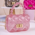 Pink jelly mini handbag with quilted pattern, pearl handle, and gold chain strap - Transparent Pink