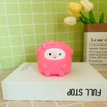 Pink My Melody cartoon character night light figurine placed on a white book - Fat Melody