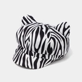 Detail view of zebra print newsboy cap featuring cute animal ears and canvas texture - Adjustable / Zebra Pattern
