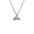 Macro view of gold fishtail necklace with sparkling zircon and green enamel detail - Light Green