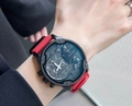 Sporty quartz watch featuring a large black matte dial with a vibrant red silicone strap - Red