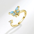 Rotating golden butterfly open ring with blue gemstone and white pearl detail - AJ101 Gold Blue Zirconia