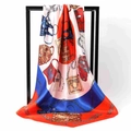 Detail of red and blue satin silk square scarf featuring handbag and chain patterns - Red