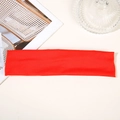 Detailed close-up of a vibrant red moisture-wicking sports headband on a white background - Red