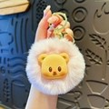 Pink plush cream bear keychain with a soft yellow cartoon face and golden clasp - Pink