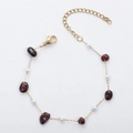 Detailed view of 18K gold chain with deep red natural stones and small white pearls - Artificial Pearl + Garnet