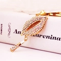 Creative red lip keychain with colorful AB rhinestones and lipstick charm pendant - Iridescent
