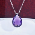 Close-up of a pear-shaped purple gemstone pendant on a silver necklace chain - Purple Zirconia Pendant (No Chain)