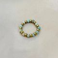 Handmade elastic ring featuring gold steel beads and light blue natural stone beads - Natural Amazonite