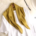 Mustard yellow satin square scarf draped on a white T-shirt with a stylish flat lay - Earthy Yellow